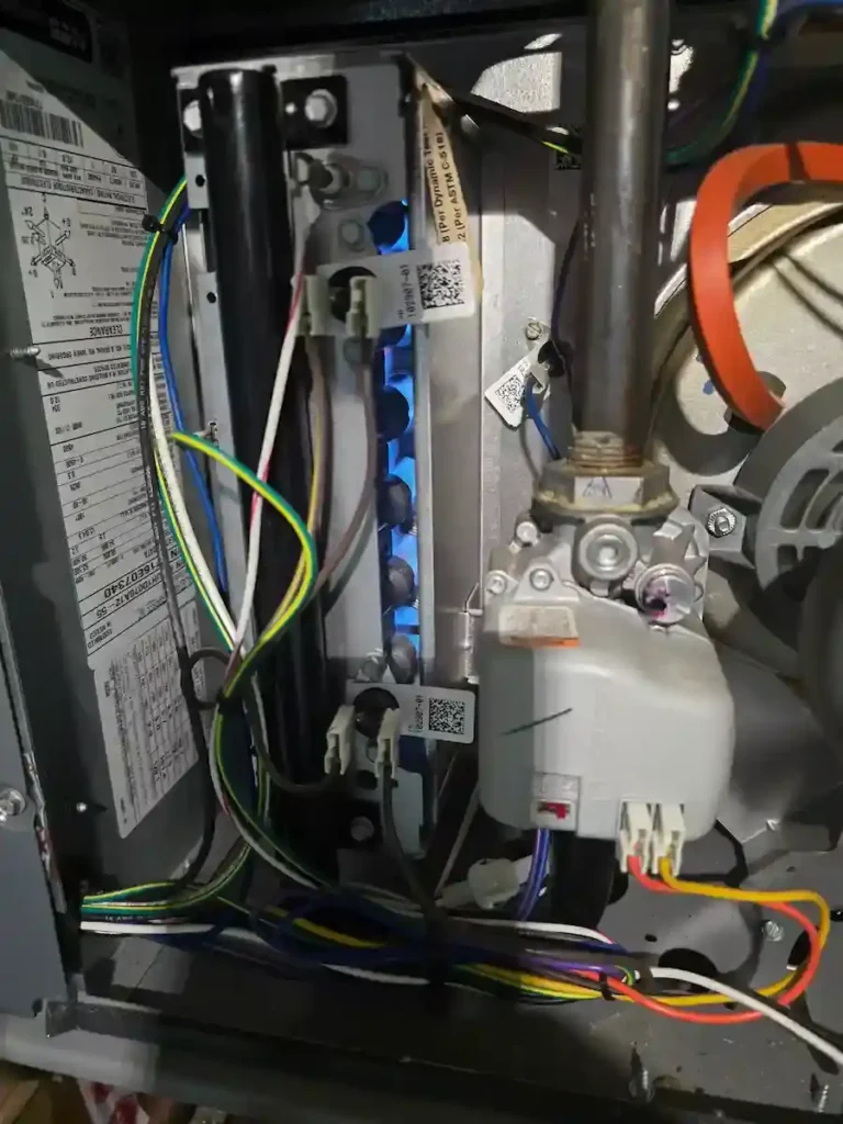 Furnace repair technician servicing a gas furnace in Irving, TX