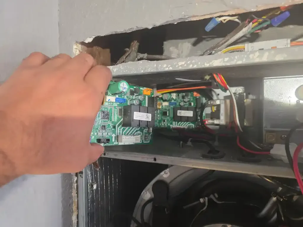 HVAC technician performing an AC tune-up in Irving, TX